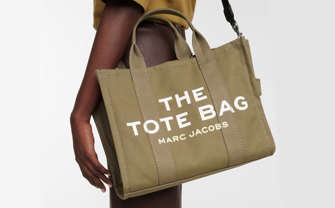 Person Wearing Marc Jacobs Tote Bag in Slate Green Person Wearing Marc Jacobs Tote Bag in Slate Green