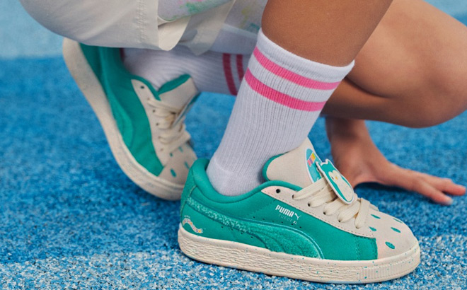 A Kid Wearing Puma x Squishmallows Suede XL Winston Sneakers