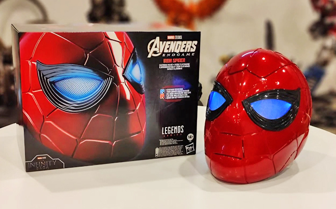 Spider Man Marvel Legends Series Iron Spider Electronic Helmet Beside its Box on a Table