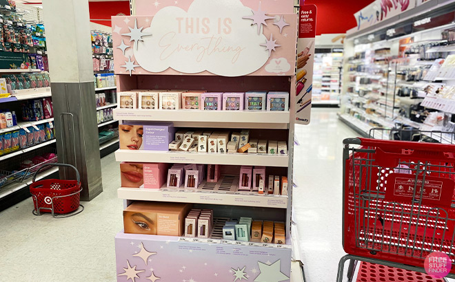 Target Shopping Cart next to Shelves with Makeup inside a Store Target Shopping Cart next to Shelves with Makeup inside a Store