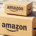 Two Amazon Boxes on a Beach Sand