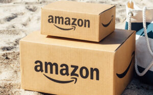 Two Amazon Boxes on a Beach Sand