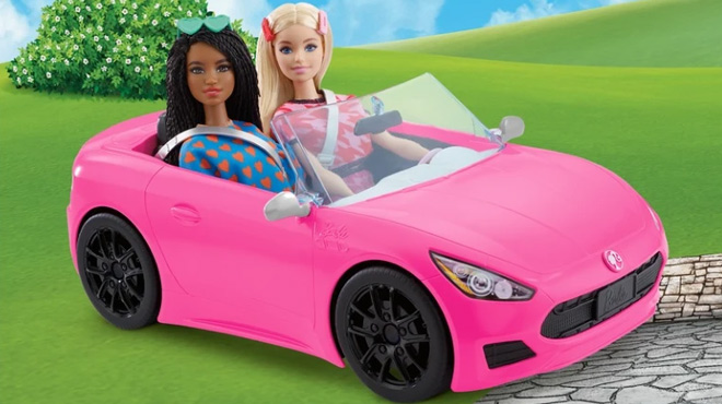 Two Barbie Dolls Sitting in the Barbie 2 Seater Convertible Car Toy