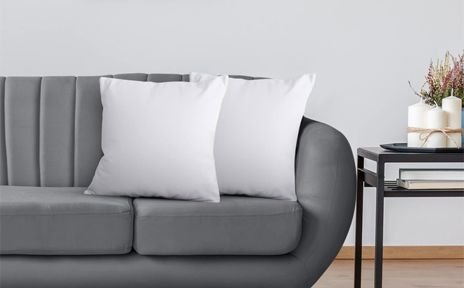 Utopia Bedding Throw Pillows Inserts Pack of 2 on a Couch in the Color White