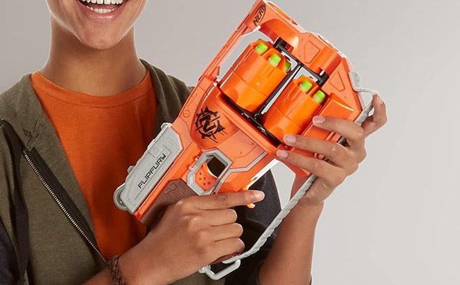 a Kid Holding NERF Zombie Strike FlipFury Blaster