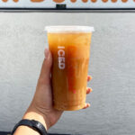 a Person Holding Dunkin Iced Coffee