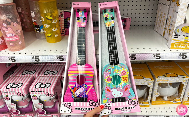 a Person Holding Hello Kitty Friends First Act Hello Kitty Ukulele