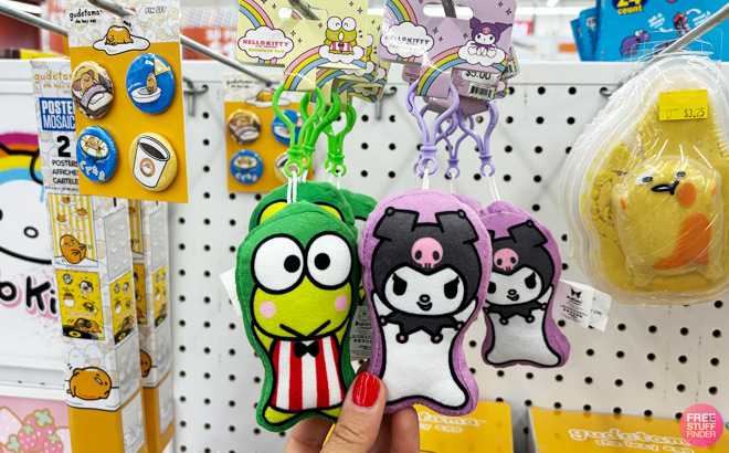 a Person Touching Hello Kitty Friends Keroppi Kuromi Backpack Clips
