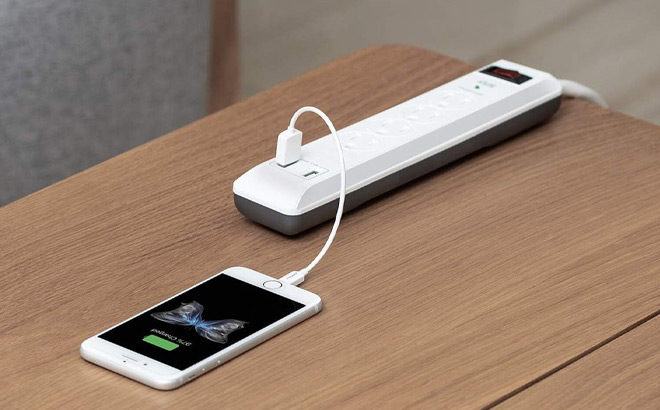 4 Outlet Surge Protector Power Strip on a Table