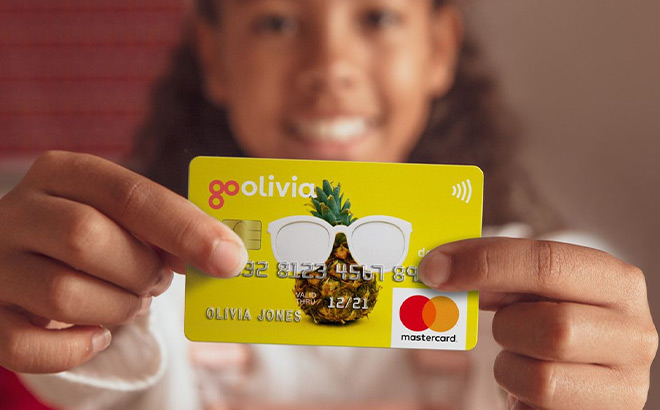 A Girl Holding a Kids Debit Card