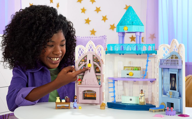 A Girl Playing With Disney Wish Rosas Castle Playset