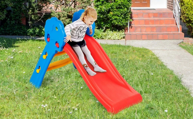 A Girl Playing on Costway Folding Climber Play Slide