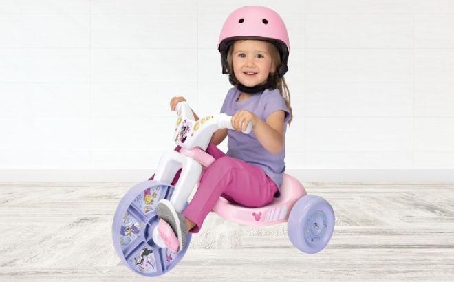 A Girl Riding a Minnie Mouse Fly Wheel Ride On Toy
