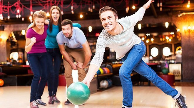 A Group of People Bowling at the Bowlero Bowling Alley