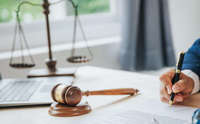 A Judge Signing Documents