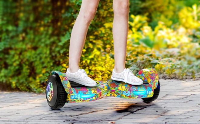 A Kid Driving Swagtron Multicolor Freestyle Hoverboard