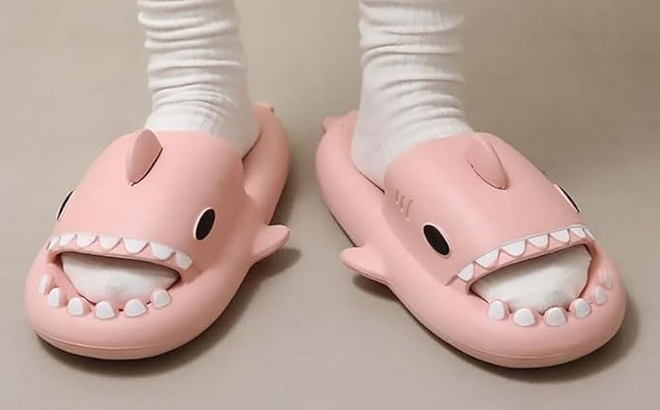 A Man Wearing Shark Slides in Pink Color