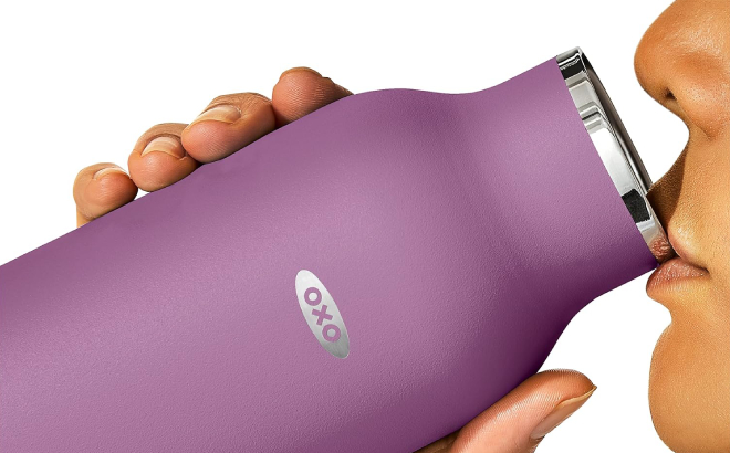A Person Drinking from an OXO Strive Insulated Water Bottle