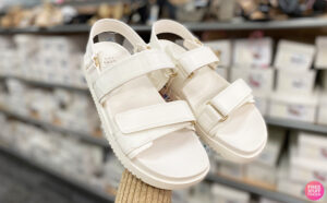 A Person Holding A New Day Womens Jonie Ankle Strap Footbed Sandals in Off White Color