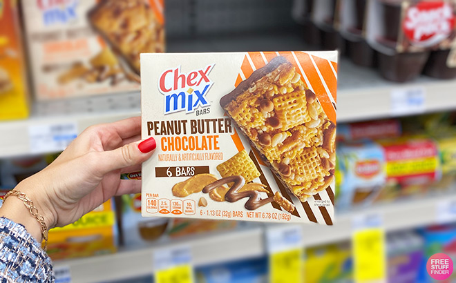 A Person Holding Chex Mix Peanut Butter Chocolate Bars