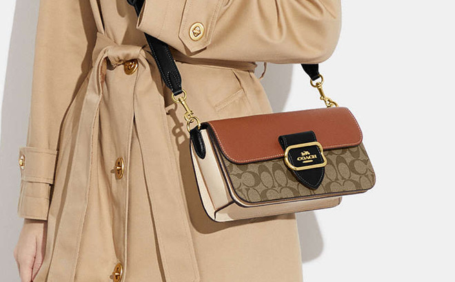 A Person Holding Coach Morgan Shoulder Bag A Person Holding Coach Morgan Shoulder Bag