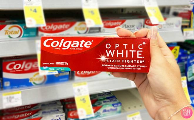 A Person Holding Colgate Optic White Toothpaste at Walgreens
