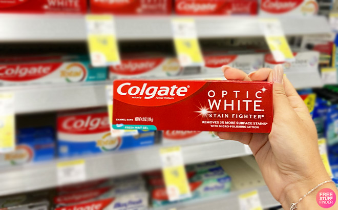 A Person Holding Colgate Whitening Toothpaste A Person Holding Colgate Whitening Toothpaste