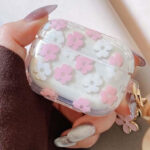 A Person Holding Cute Clear Pink Flower Floral Protective Earphone Cover Case