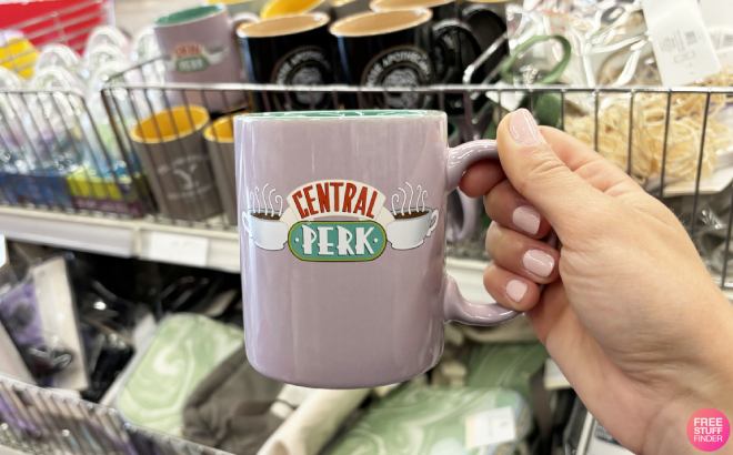 A Person Holding Friends TV Central Perk Ceramic Mug