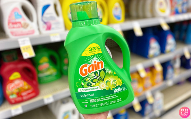 A Person Holding Gain Liquid Laundry Detegrent at Walgreens