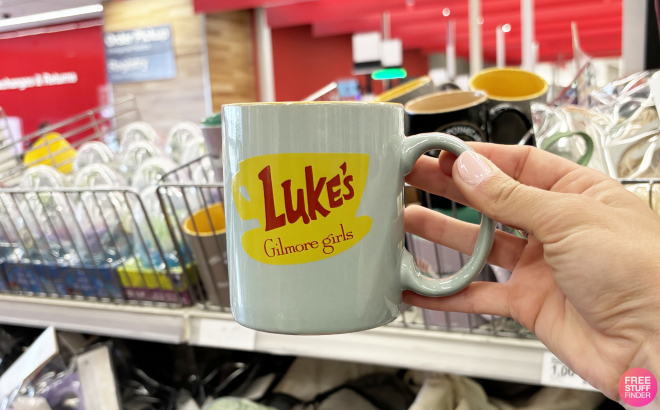 A Person Holding Gilmore Girls Lukes Diner Ceramic Mug