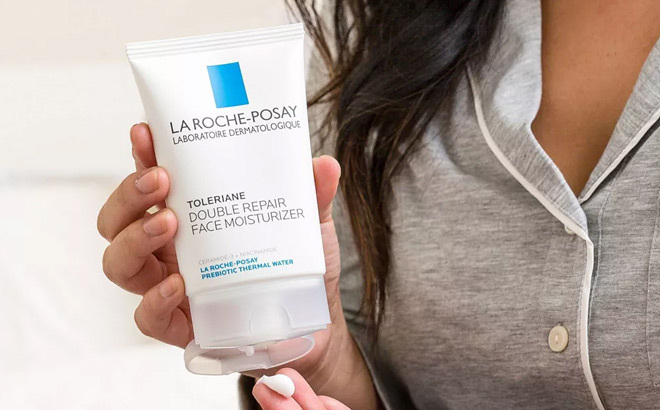 A Person Holding La Roche Posay Toleriane Double Repair Face Moisturizer with Ceramide and Niacinamide