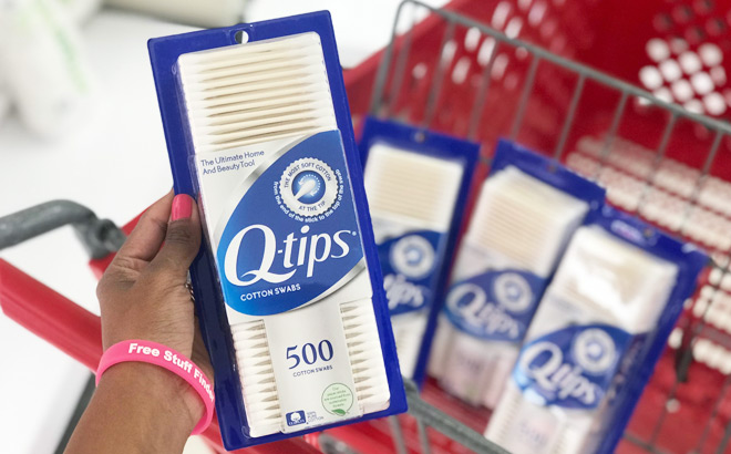 A Person Holding Q Tips Cotton Swabs 500 Count in Front of a Cart at Target