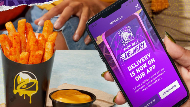 A Person Holding a Mobile Phone Showing Taco Bell Rewards App on the Screen