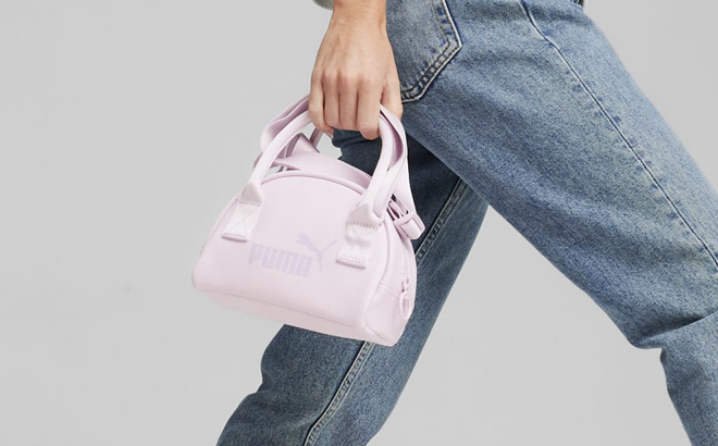A Person Holding a Puma Small Core Up Carrying Bag