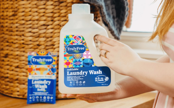 A Person Holding a Truly Free Laundry Wash Refillable Bottle