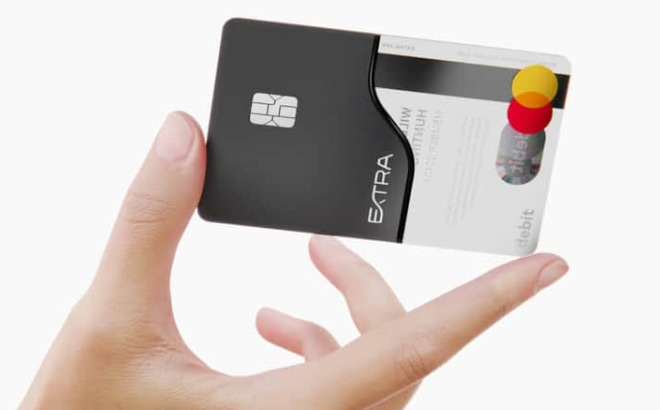 A Person Holding an Extra Card