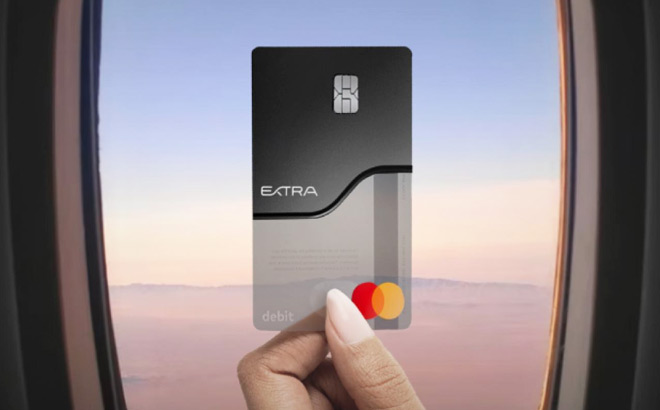 A Person Holding an Extra Debit Card