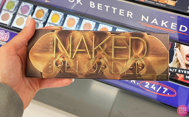 A Person Holding an Urban Decay Naked Reloaded Eyeshadow Palette