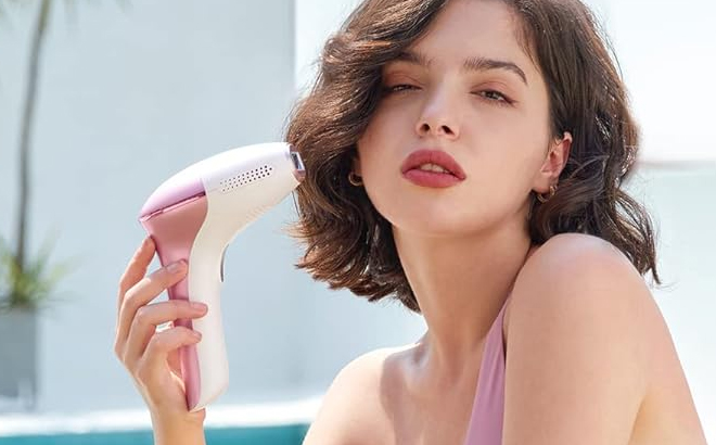 A Person Holding the INNZA IPL Hair Removal Device