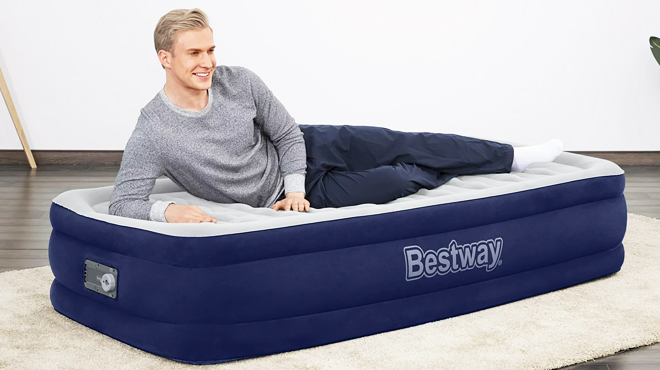 A Person Laying Down on Bestway Tritech Twin Air Mattress