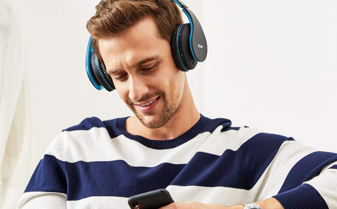 A Person Listening to Music on Zihnic Foldable Bluetooth Headphones