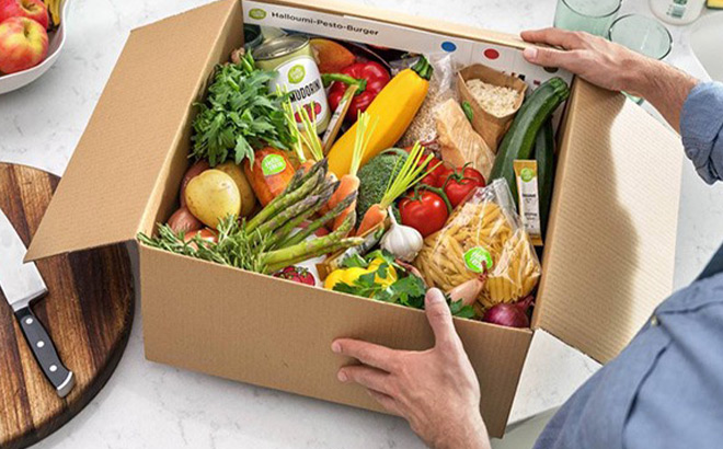 A Person Opening a Box full of Fresh Produce