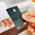 A Person Paying with Extra Debit Card