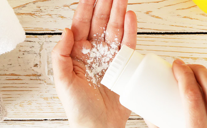 A Person Pouring Talcum Powder into Hand