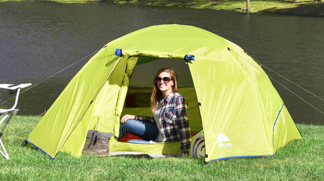 A Person Sitting Inside Ozark Trail 4 Person Four Season Dome Tent