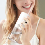 A Person Using Tinana Portable Cordless Water Dental Flosser