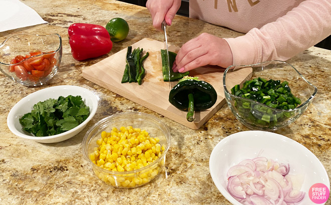 A Person Using a Home Chef Meal Kit to Prepare a Meal