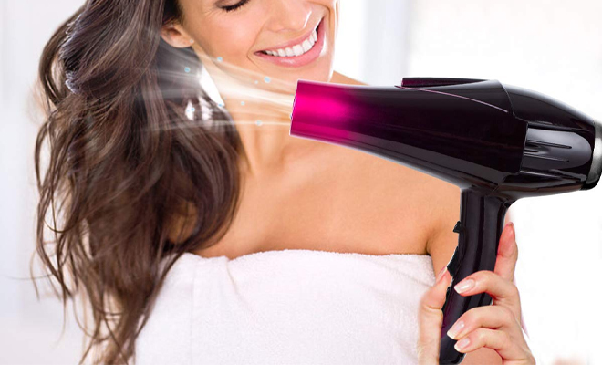 A Person Using the Professional Hair Dryer with Blue Light A Person Using the Professional Hair Dryer with Blue Light