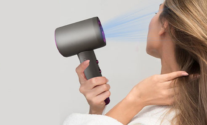 A Person Using the Professional Ionic Hair Dryer A Person Using the Professional Ionic Hair Dryer